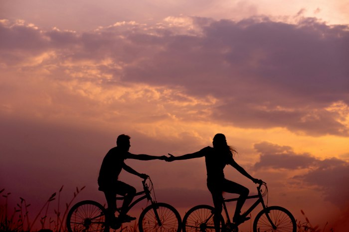 Couple at sunset holding each other
